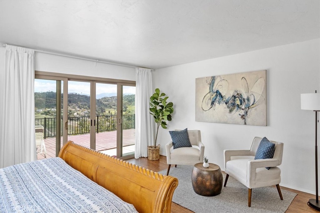 3240 Skycrest Drive Fallbrook, CA 92028 - Photo 21 of 40 a bedroom with furniture and a large window