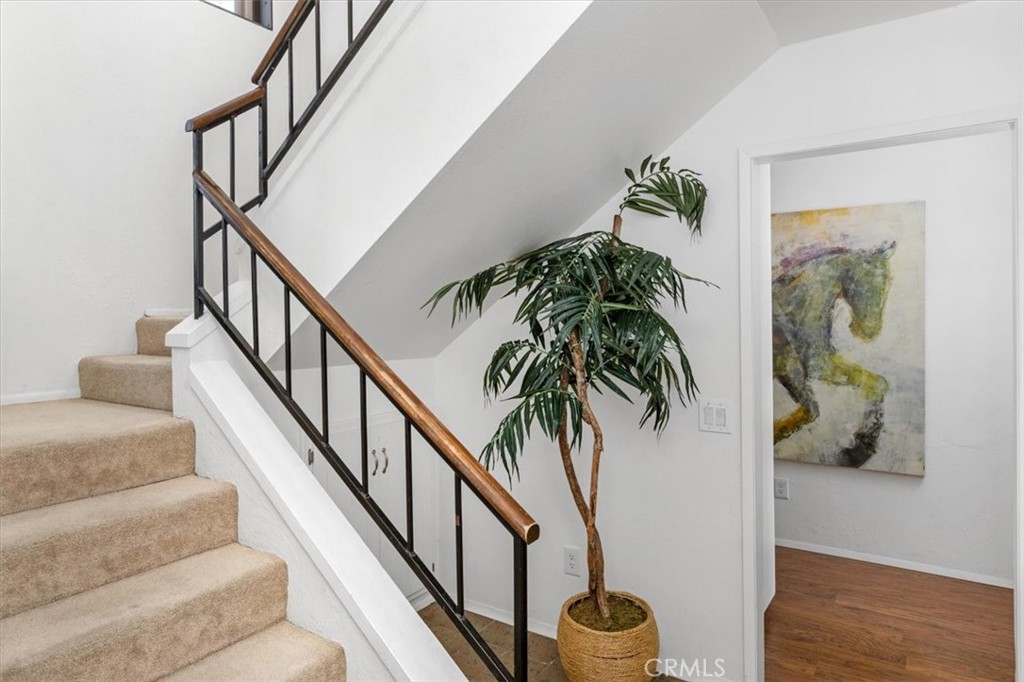 3240 Skycrest Drive Fallbrook, CA 92028 - Photo 24 of 40 a porch with wooden floor and a potted plant
