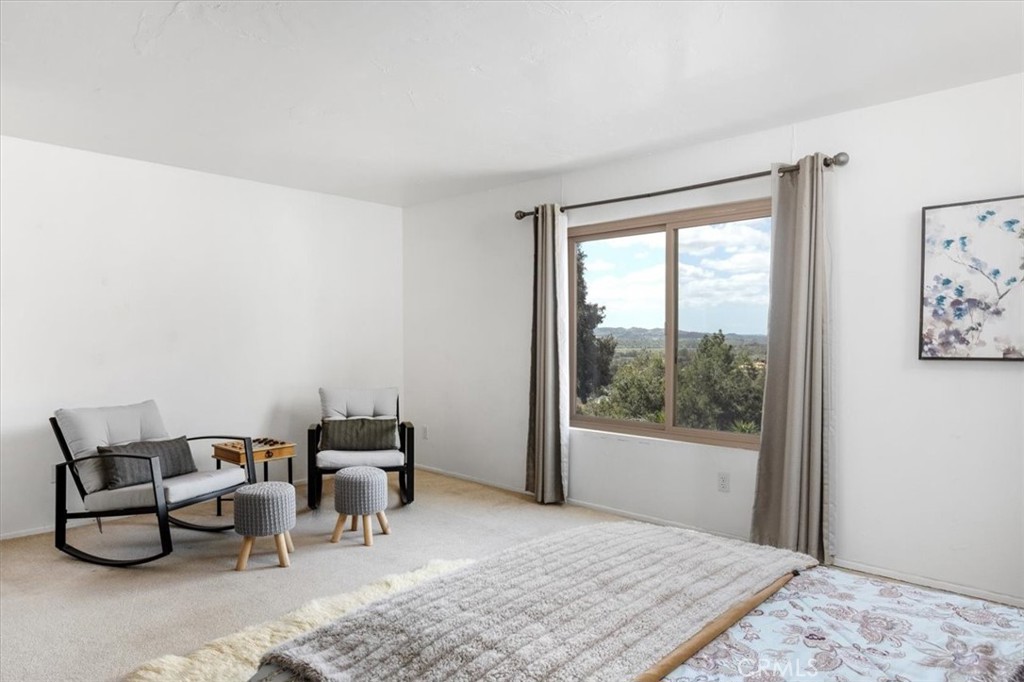 3240 Skycrest Drive Fallbrook, CA 92028 - Photo 26 of 40 a bedroom with furniture and a window