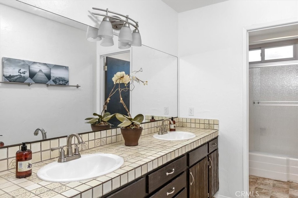 3240 Skycrest Drive Fallbrook, CA 92028 - Photo 28 of 40 a bathroom with a sink double vanity and a mirror