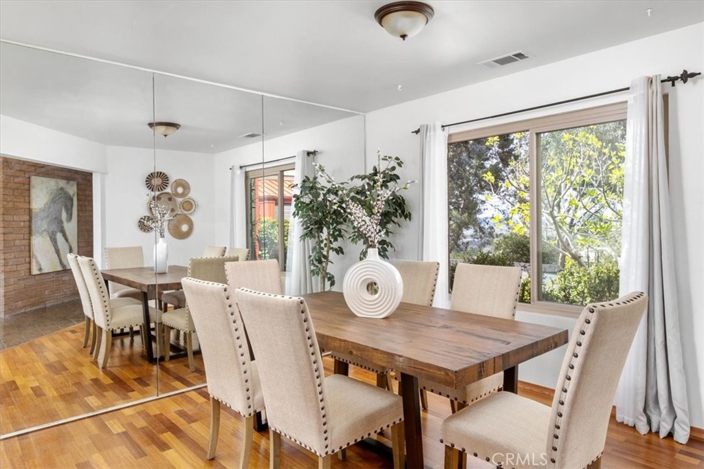 3240 Skycrest Drive Fallbrook, CA 92028 - Photo 9 of 40 a view of a dining room with furniture window and wooden floor