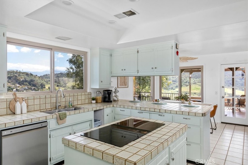 3240 Skycrest Drive Fallbrook, CA 92028 - Photo 10 of 40 a kitchen that has a sink and a stove in it