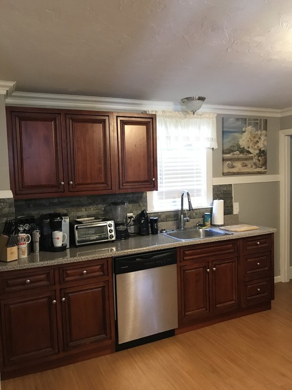 5 Oak Street Middleboro, MA 02346 - Photo 8 of 27 a kitchen with stainless steel appliances granite countertop wooden cabinets and a sink