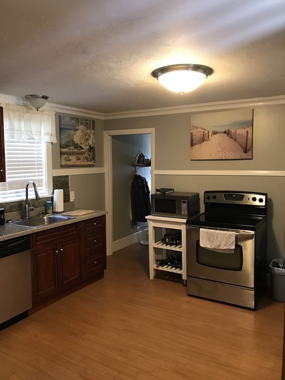5 Oak Street Middleboro, MA 02346 - Photo 10 of 27 a kitchen with a stove and a refrigerator