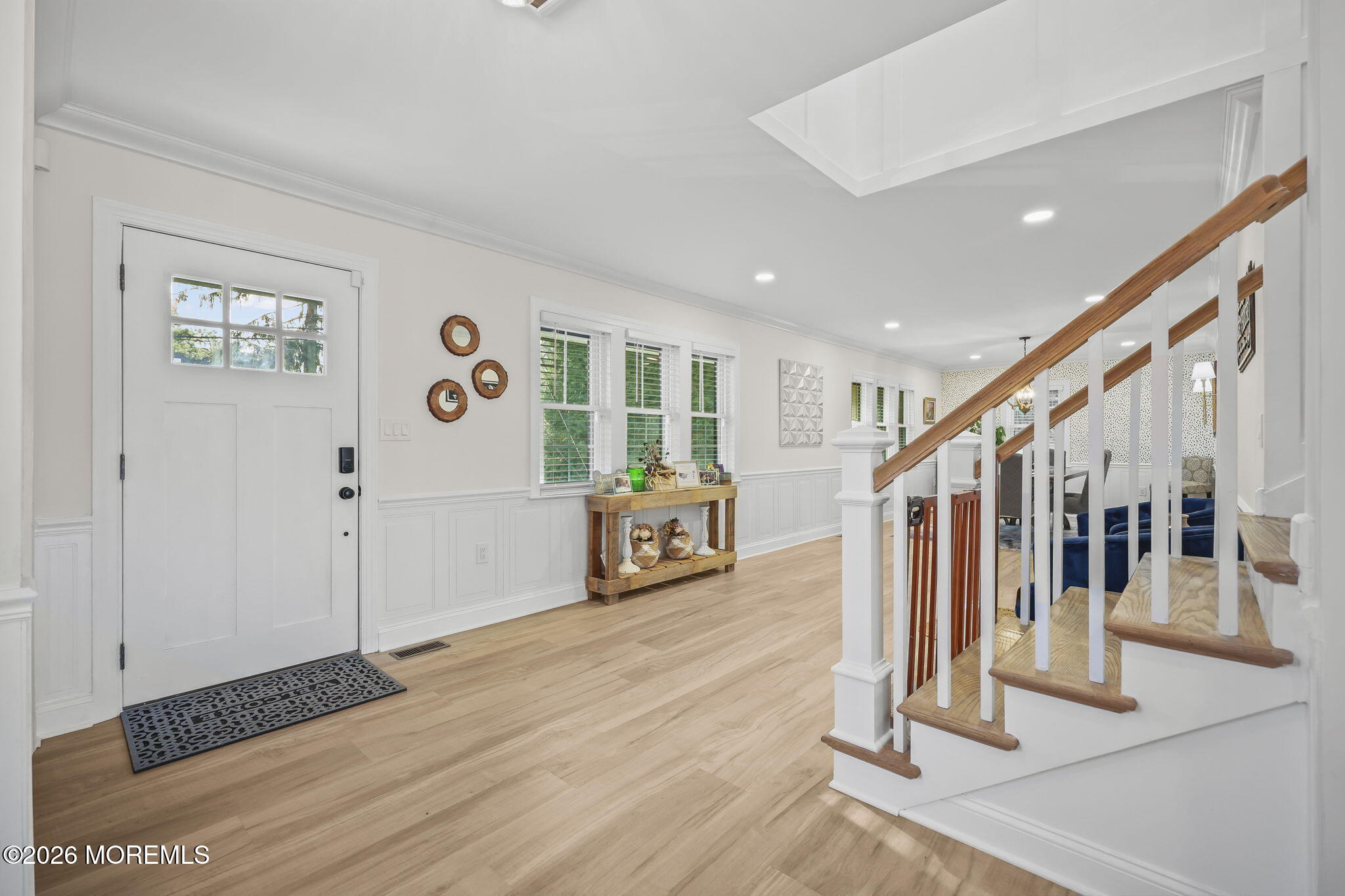 91 Davis Lane Red Bank, NJ 07701 - Photo 11 of 87 a view of a hallway with wooden floor and stairs