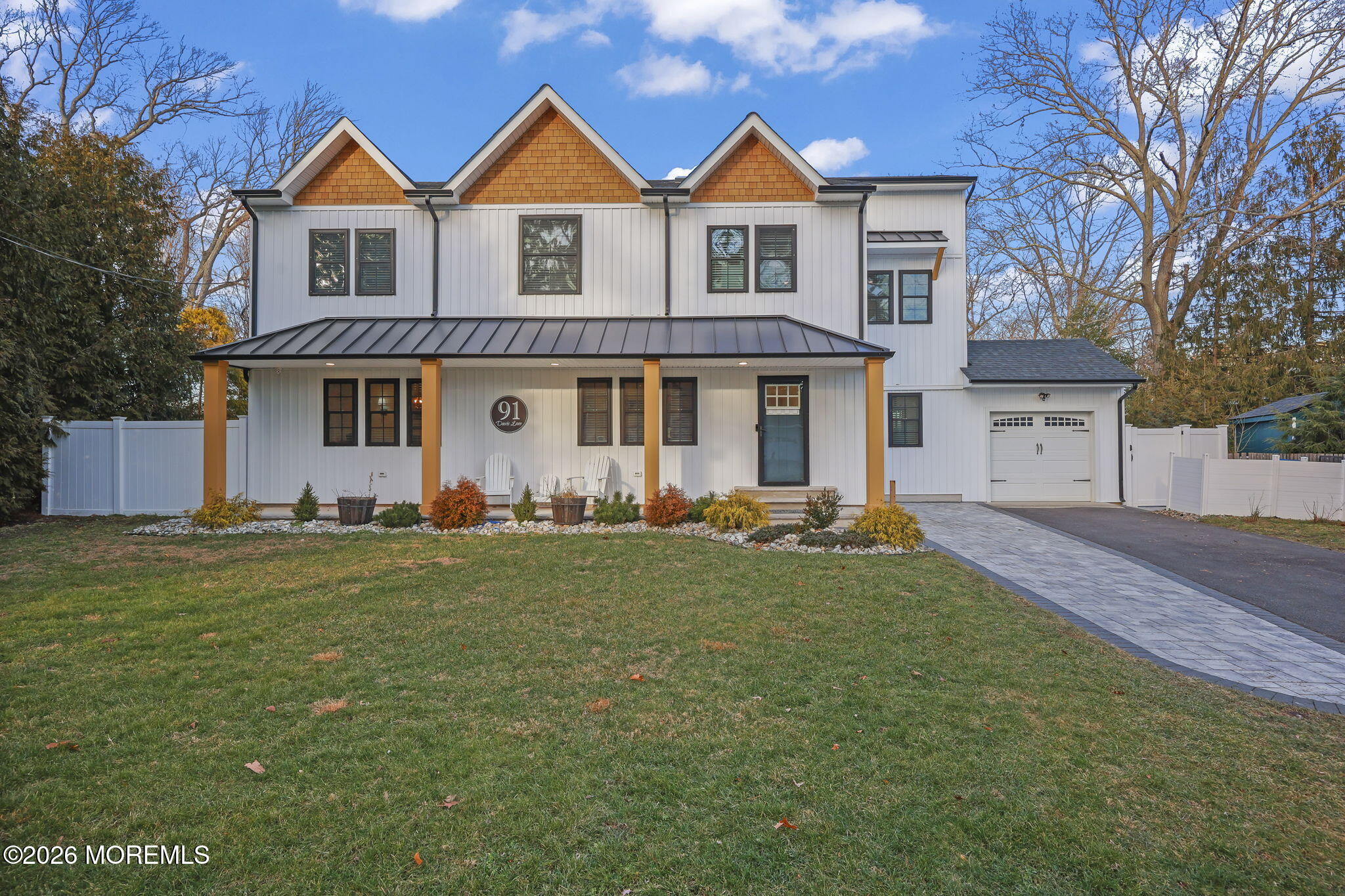 91 Davis Lane Red Bank, NJ 07701 - Photo 2 of 87 a front view of a house with garden