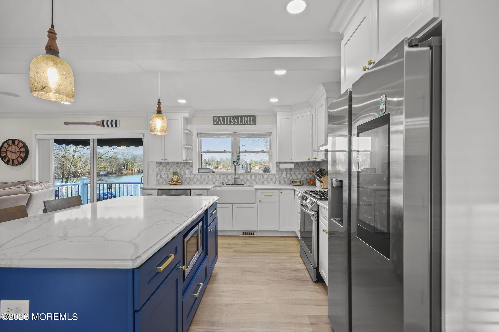91 Davis Lane Red Bank, NJ 07701 - Photo 3 of 87 a kitchen with kitchen island granite countertop a center island a sink stainless steel appliances and cabinets
