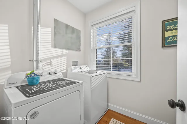 a view of a livingroom with furniture and a kitchen