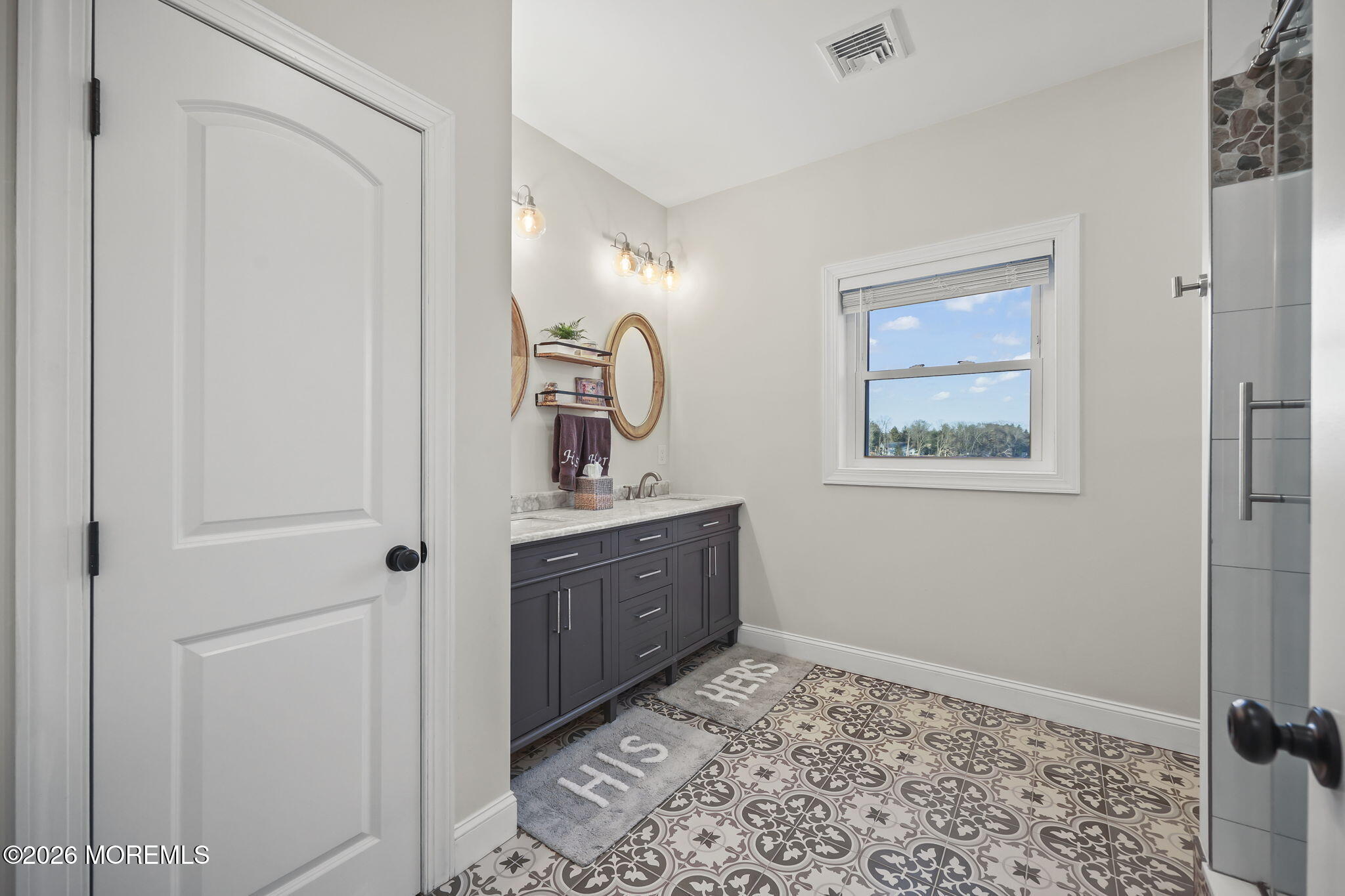 91 Davis Lane Red Bank, NJ 07701 - Photo 33 of 87 a bathroom with a sink and mirror
