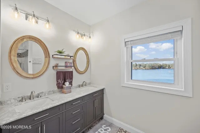 a view of a house with a yard and covered with snow