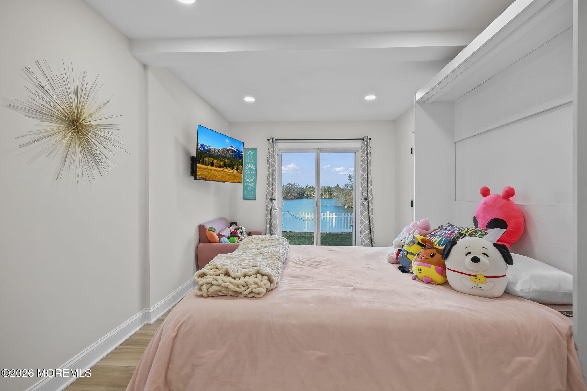 91 Davis Lane Red Bank, NJ 07701 - Photo 55 of 87 a bedroom with a bed a couch and a potted plant