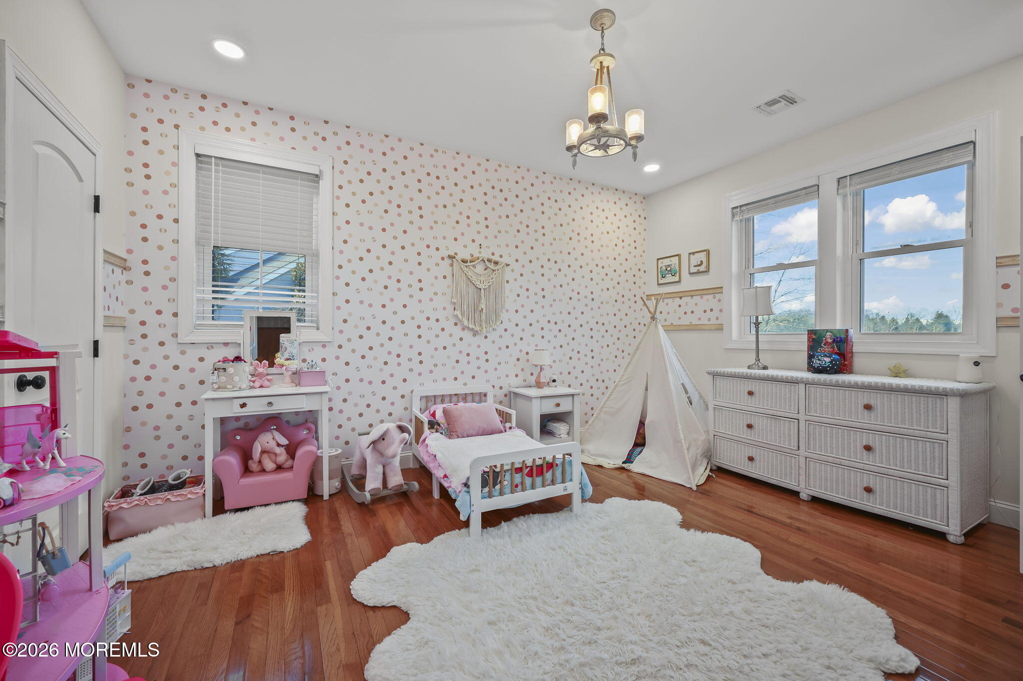 91 Davis Lane Red Bank, NJ 07701 - Photo 58 of 87 a bedroom with furniture and a chandelier