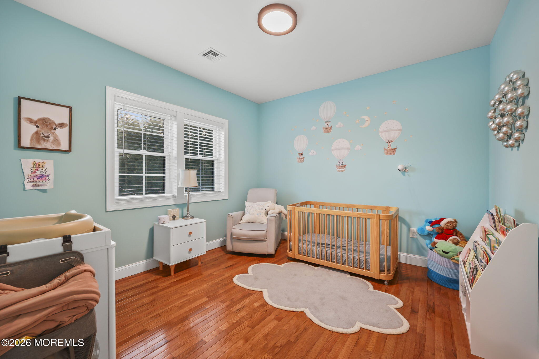 91 Davis Lane Red Bank, NJ 07701 - Photo 61 of 87 a bedroom with furniture and a wooden floor