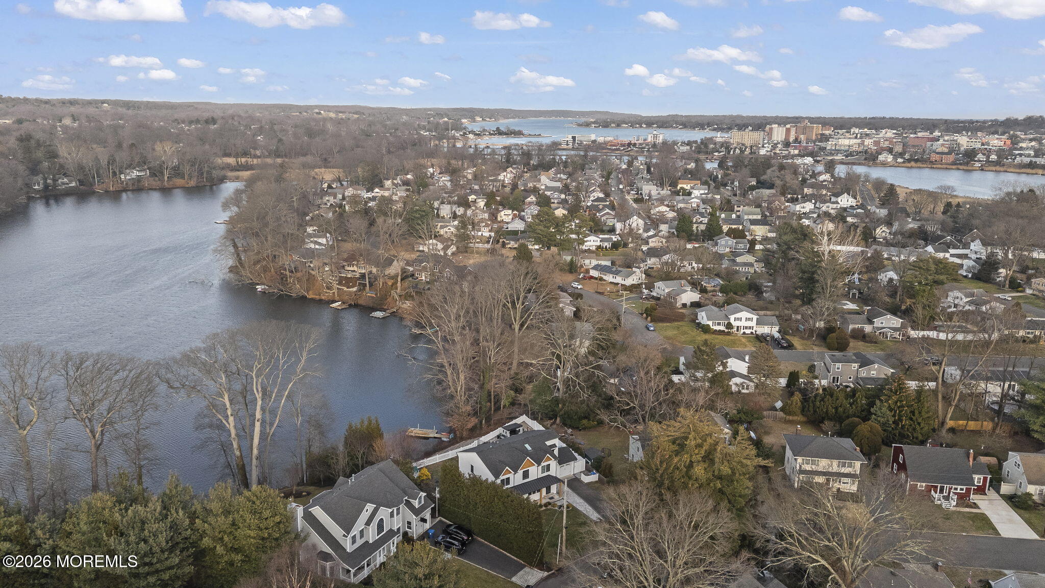 91 Davis Lane Red Bank, NJ 07701 - Photo 79 of 87 an aerial view of a house with a lake view