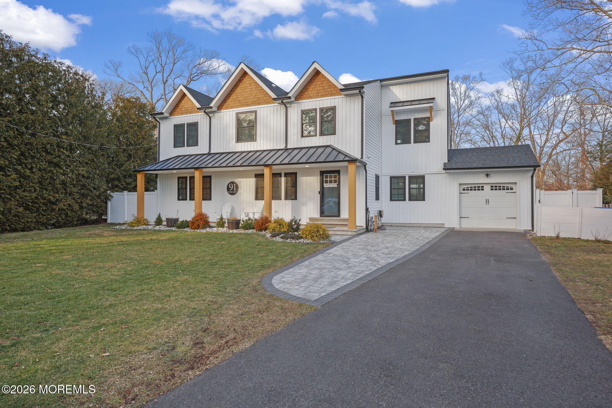91 Davis Lane Red Bank, NJ 07701 - Photo 8 of 87 a front view of a house with a garden and yard