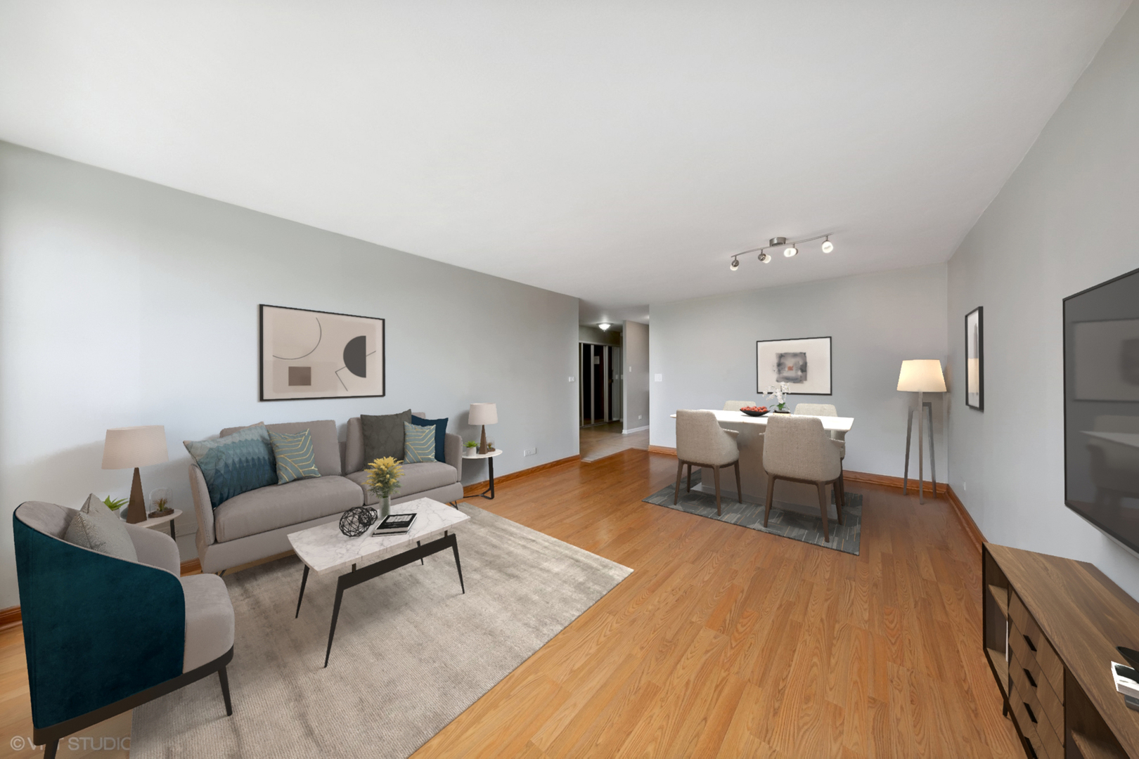 720 West Gordon Terrace, Unit 14F Chicago, IL 60613 - Photo 3 of 17 a living room with furniture and a table