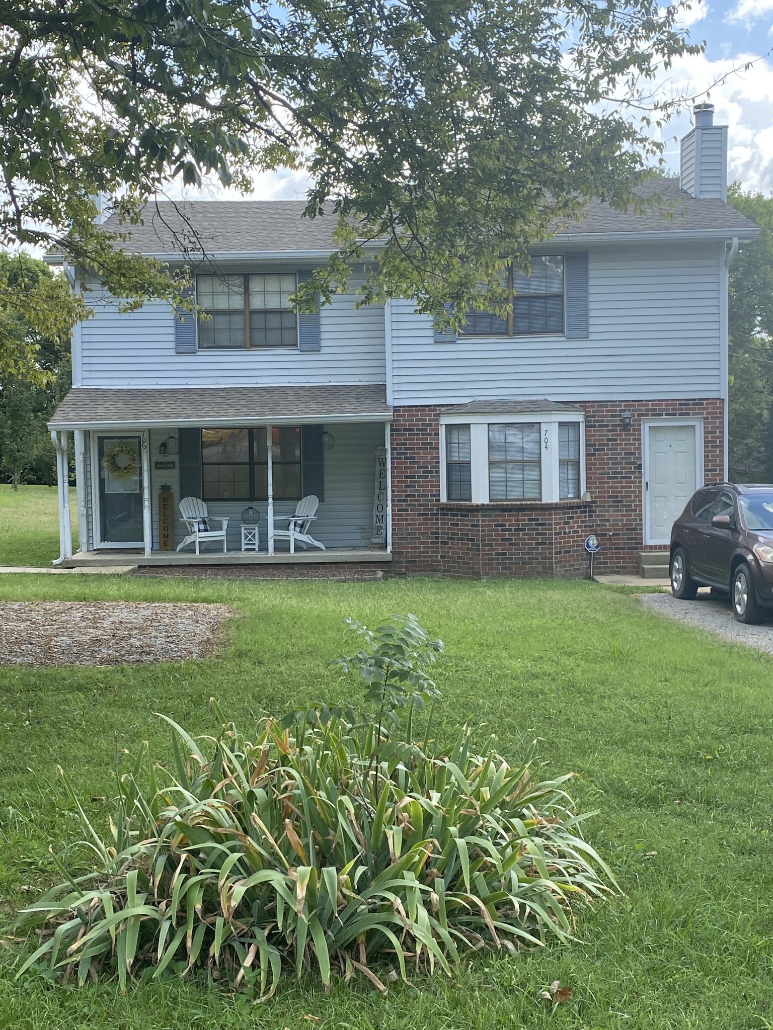704 Neelys Bend Road Madison, TN 37115 - Photo 1 of 15 a front view of a house with garden