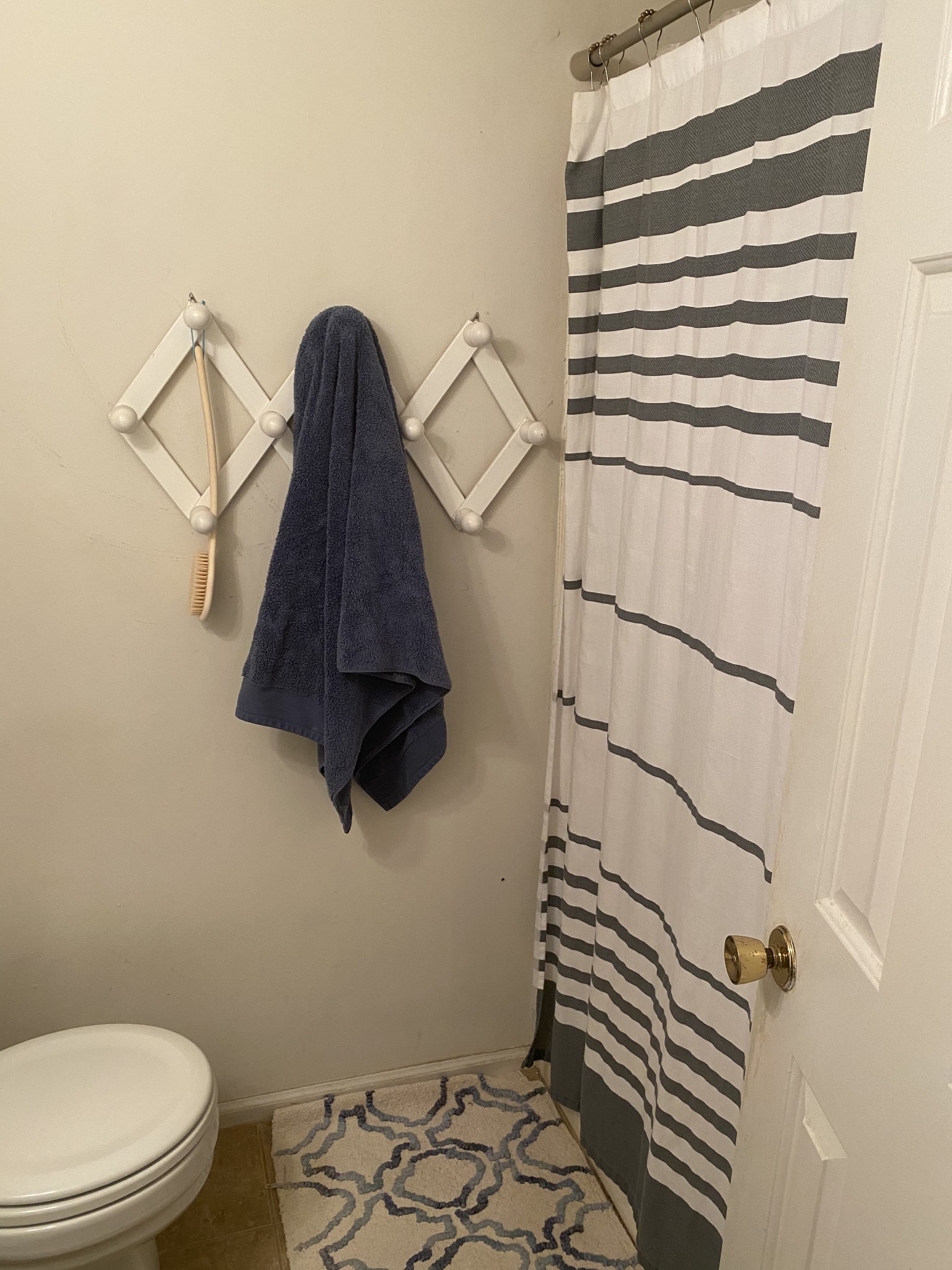 704 Neelys Bend Road Madison, TN 37115 - Photo 14 of 15 a bathroom with a toilet and a shower curtain