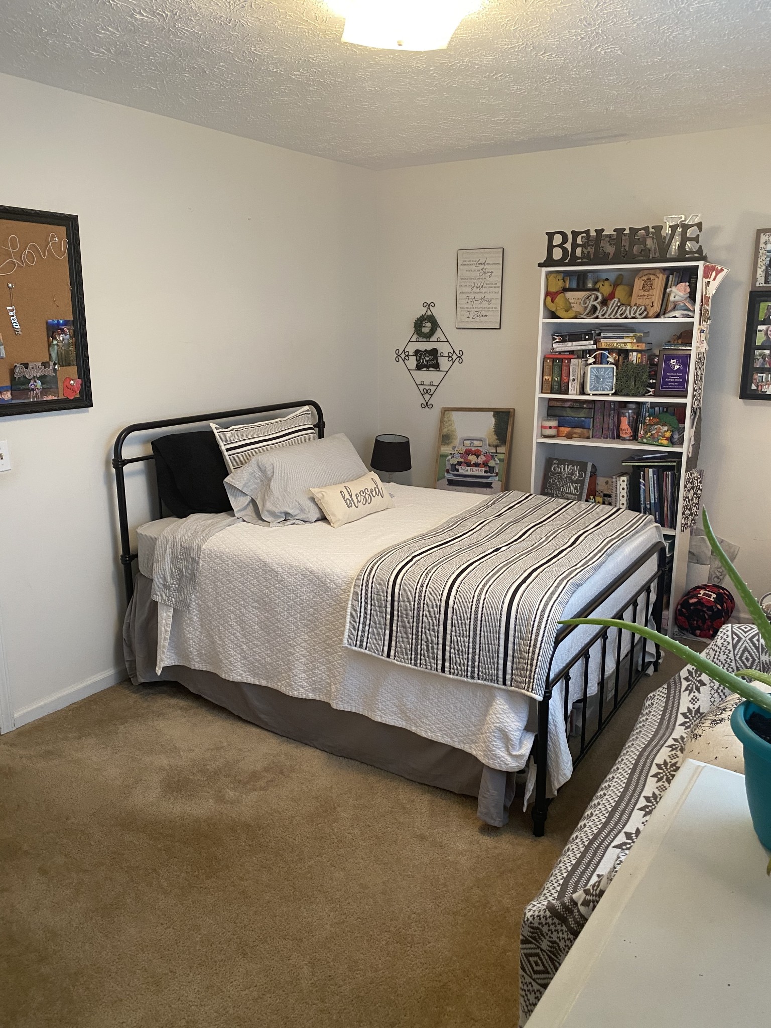 704 Neelys Bend Road Madison, TN 37115 - Photo 15 of 15 a bedroom with a large bed and a book shelf