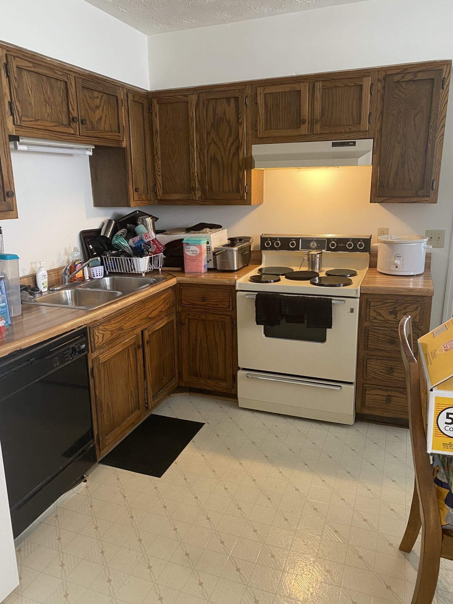 704 Neelys Bend Road Madison, TN 37115 - Photo 6 of 15 a kitchen with a stove top oven sink and cabinets