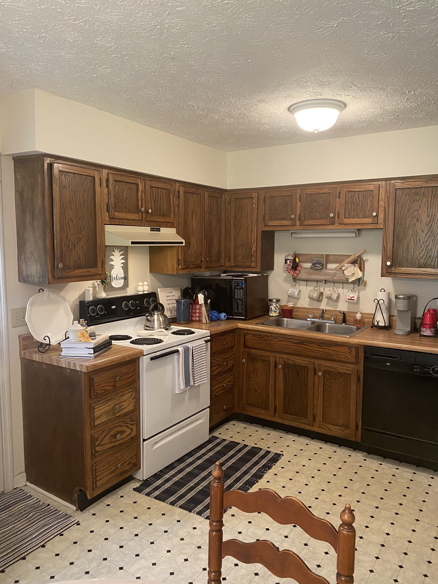 704 Neelys Bend Road Madison, TN 37115 - Photo 8 of 15 a kitchen with granite countertop a sink and wooden cabinets
