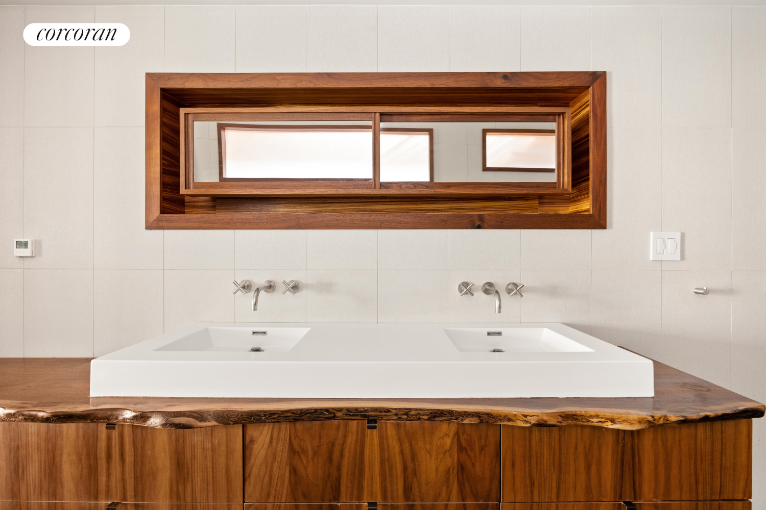 52 Sidney Place Brooklyn, NY 11201 - Photo 14 of 28 a bathroom with a sink and a mirror