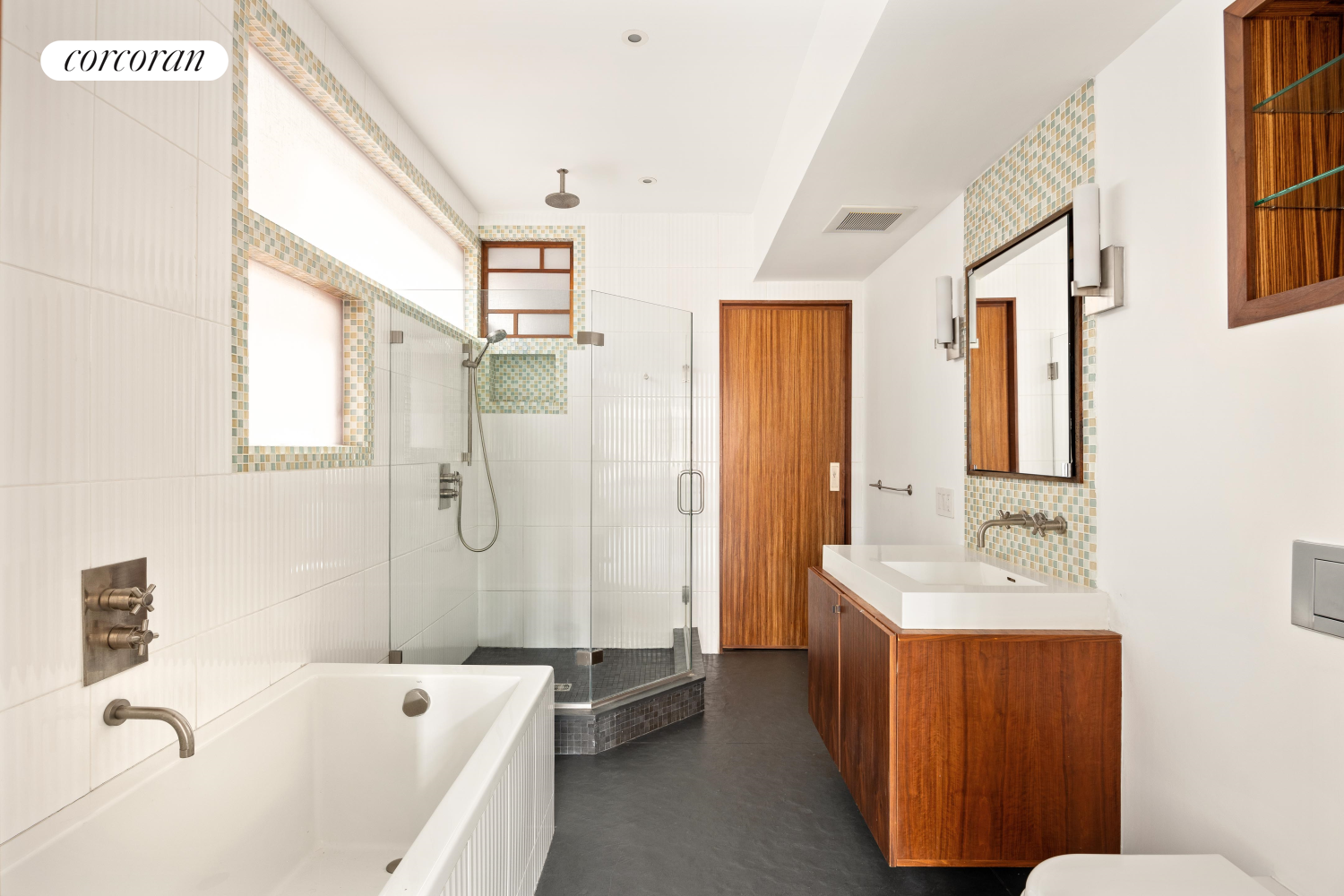 52 Sidney Place Brooklyn, NY 11201 - Photo 15 of 28 a bathroom with a tub sink and mirror