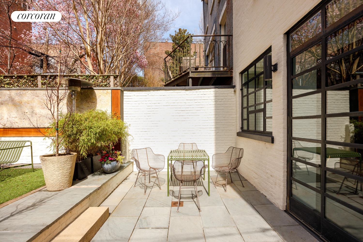 52 Sidney Place Brooklyn, NY 11201 - Photo 7 of 28 a building outdoor space with patio furniture and potted plants