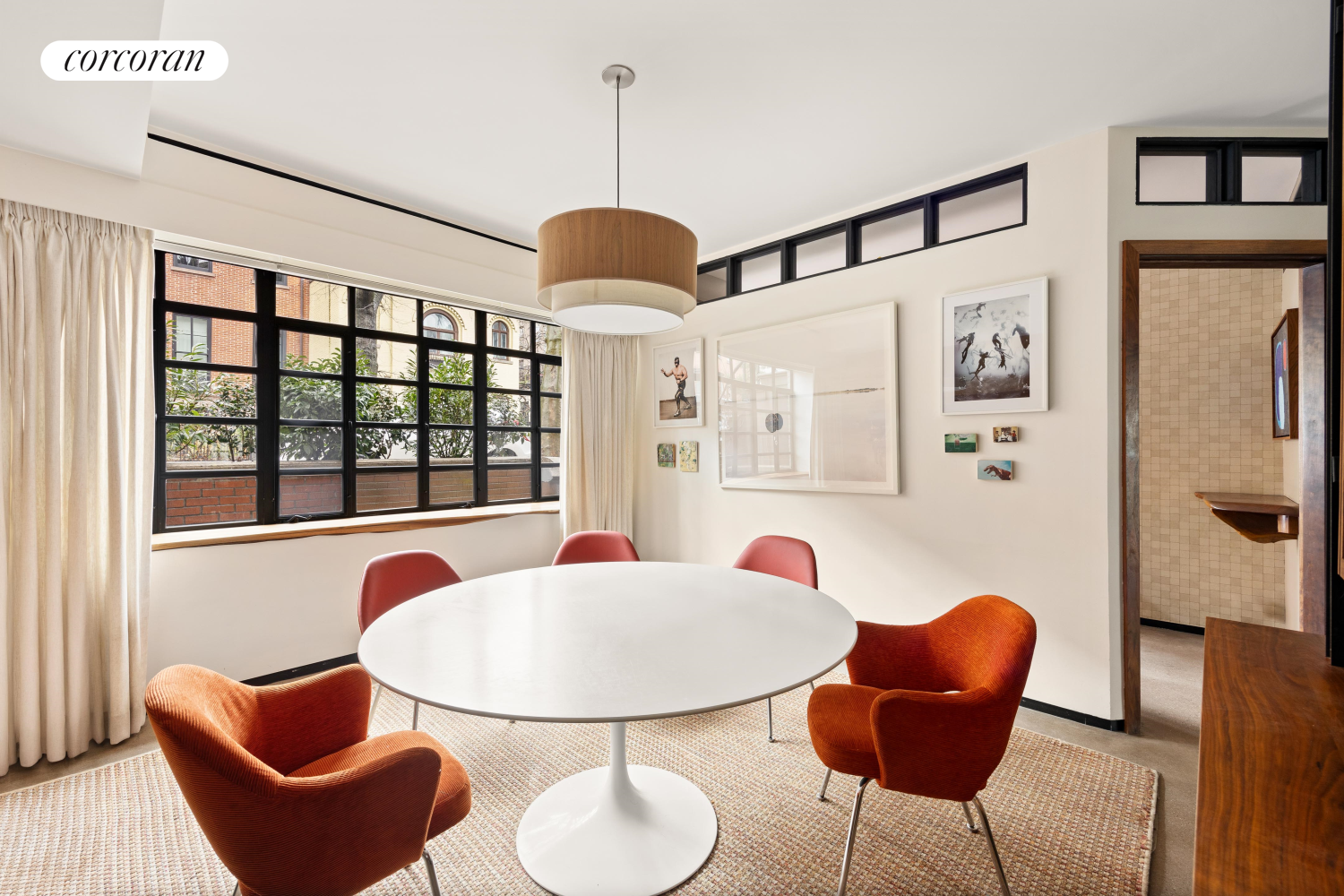 52 Sidney Place Brooklyn, NY 11201 - Photo 8 of 28 a dining room with furniture a chandelier and window