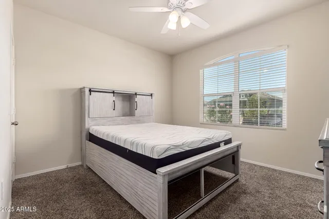 a room with a bed and a chandelier