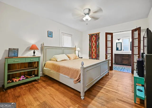 a bed room with a bed and a television