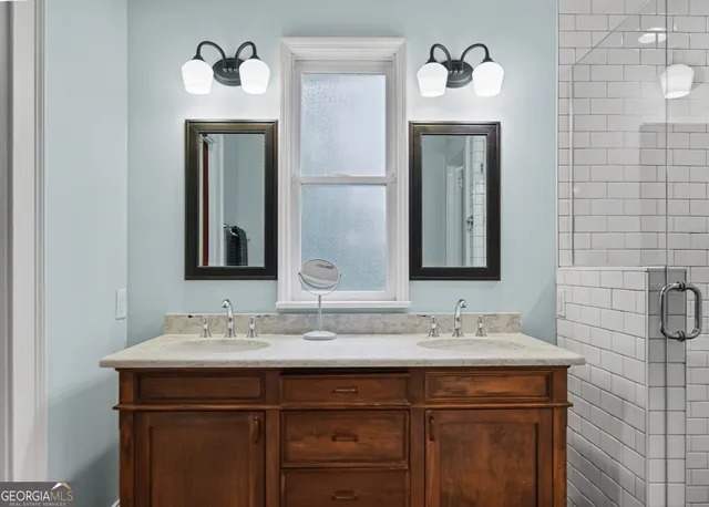 a bathroom with a sink and a mirror