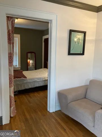 a bedroom with a bed and a couch