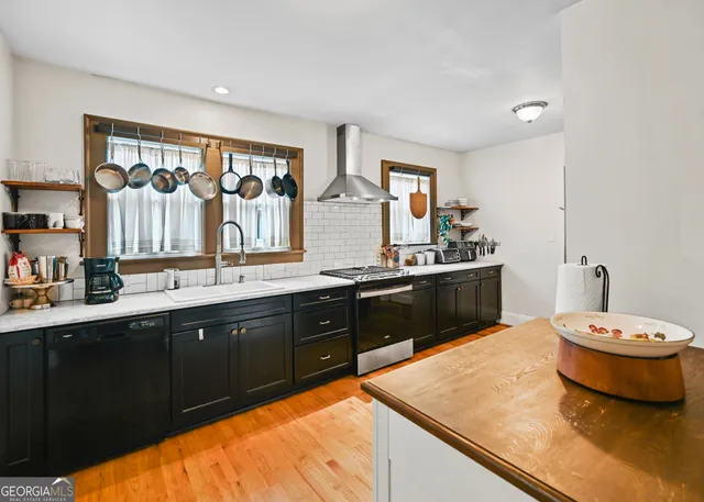 a spacious bathroom with a granite countertop sink and a mirror