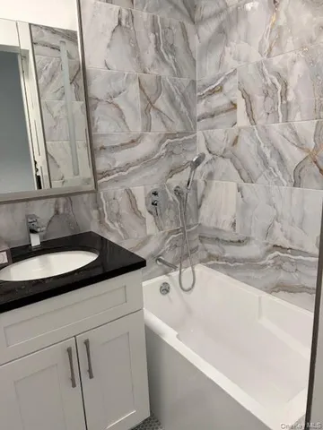 a view of entryway and gallery with wooden floor