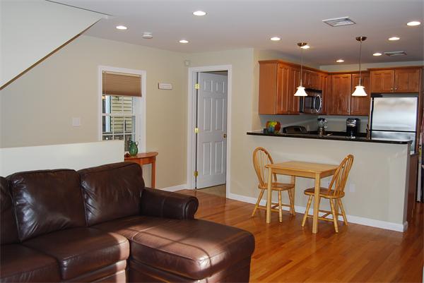 349 Norfolk Street, Unit R Cambridge, MA 02139 - Photo 2 of 11 a living room with furniture and a wooden floor