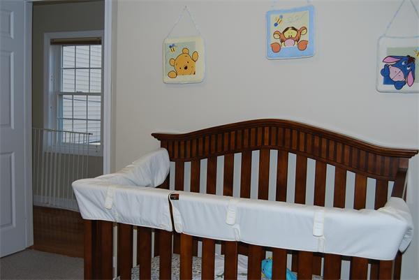 349 Norfolk Street, Unit R Cambridge, MA 02139 - Photo 7 of 11 a bedroom with a bed and wooden floor
