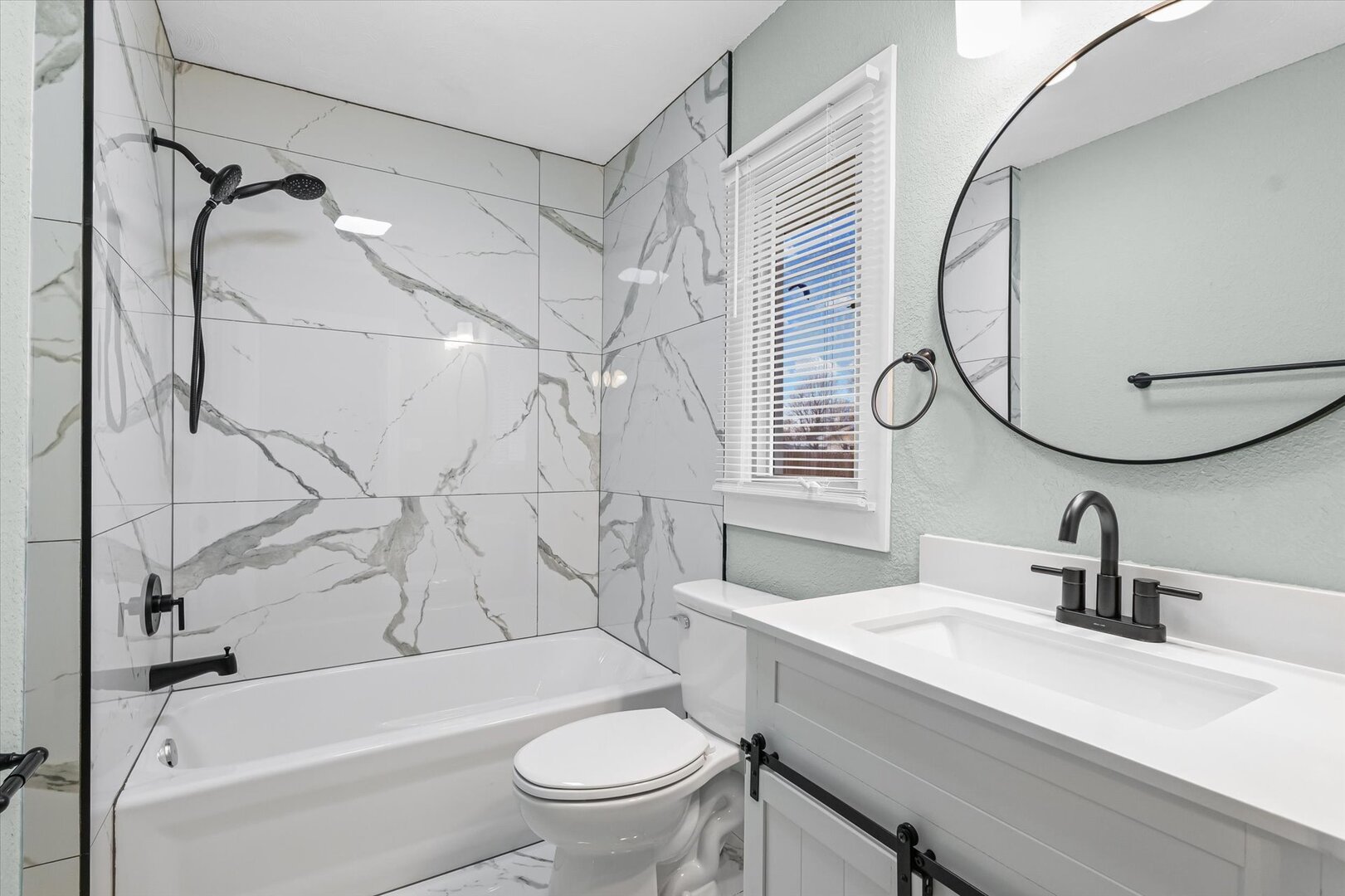 10 East Locust Street Ashmore, IL 61912 - Photo 21 of 28 a bathroom with a sink a toilet and a mirror