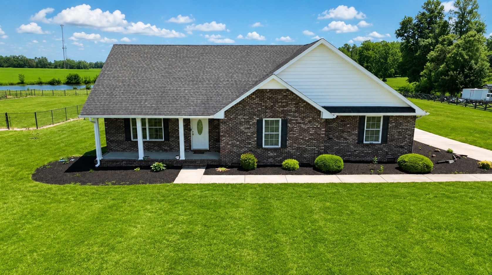 663 Jackson Road Portland, TN 37148 - Photo 2 of 32 a front view of a house with a yard and garage