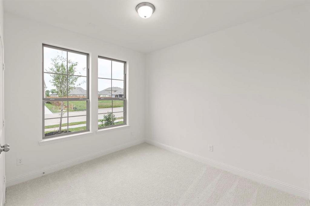 1443 Canadian Lane Van Alstyne, TX 75495 - Photo 13 of 24 14-1443-canadian-ln-van-alstyne-tx-secondary-bedroom