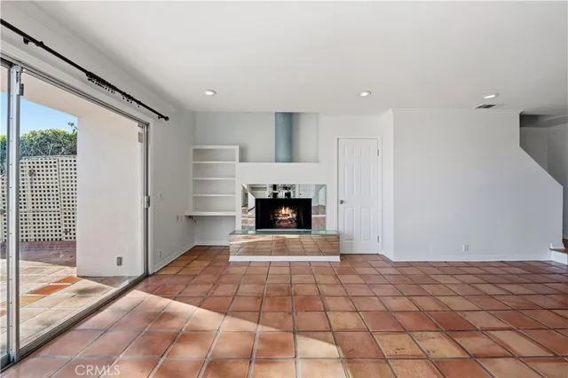 a bedroom with a bed and a fireplace