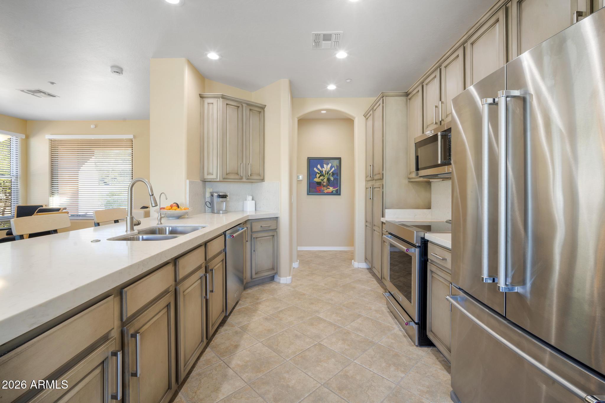 11448 East Raintree Drive Scottsdale, AZ 85255 - Photo 12 of 37 a large kitchen with a large window
