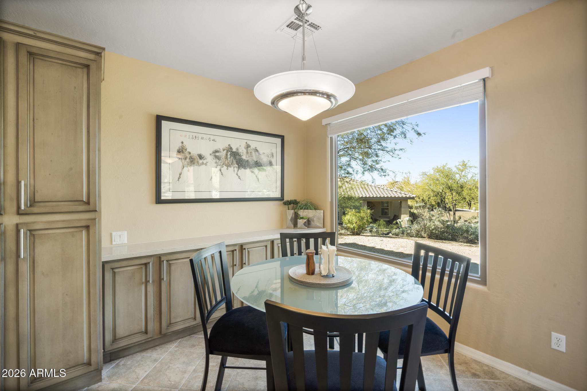 11448 East Raintree Drive Scottsdale, AZ 85255 - Photo 15 of 37 a view of a dining room with furniture window and outside view