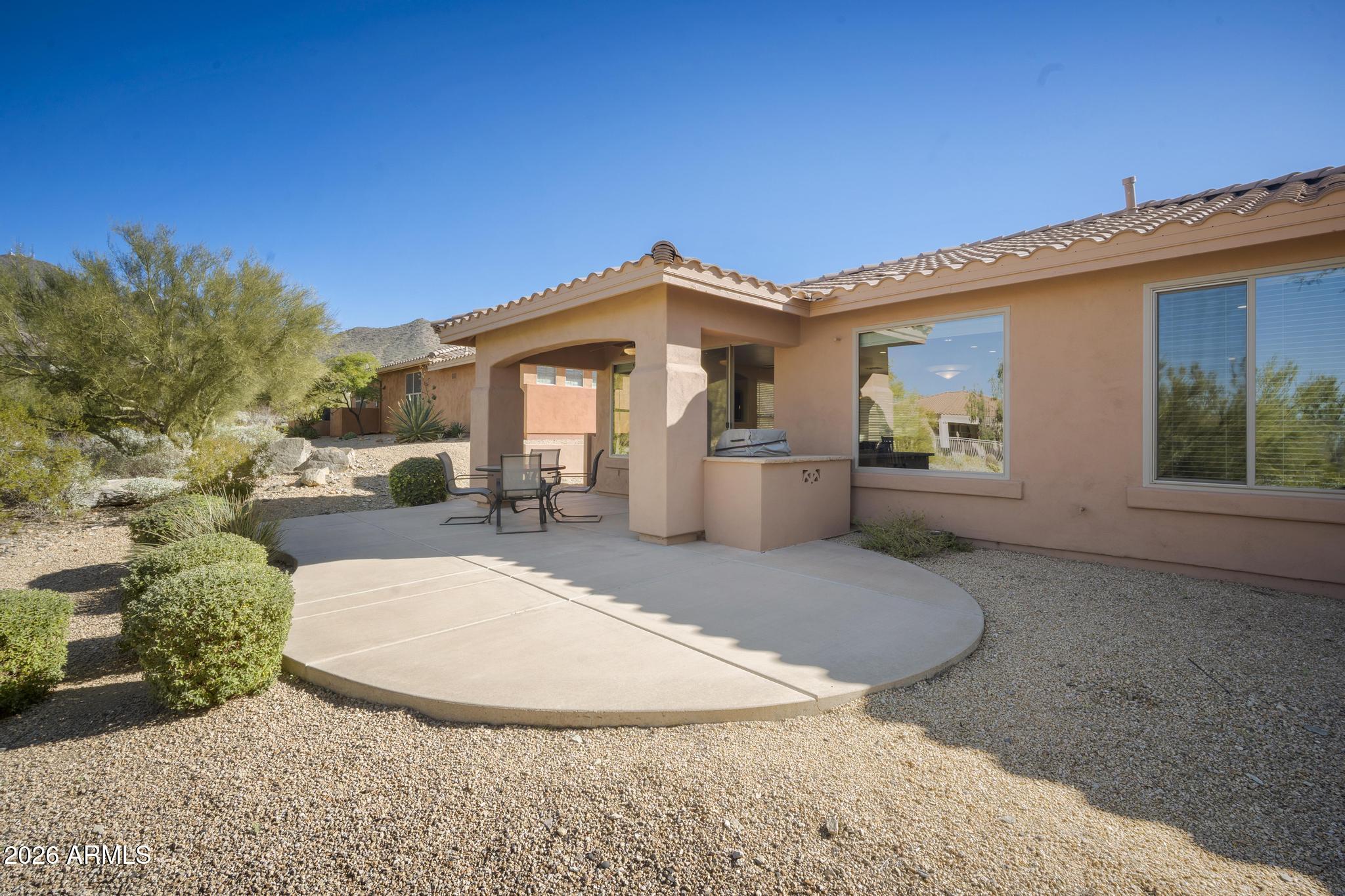 11448 East Raintree Drive Scottsdale, AZ 85255 - Photo 18 of 37 a view of a house with a yard