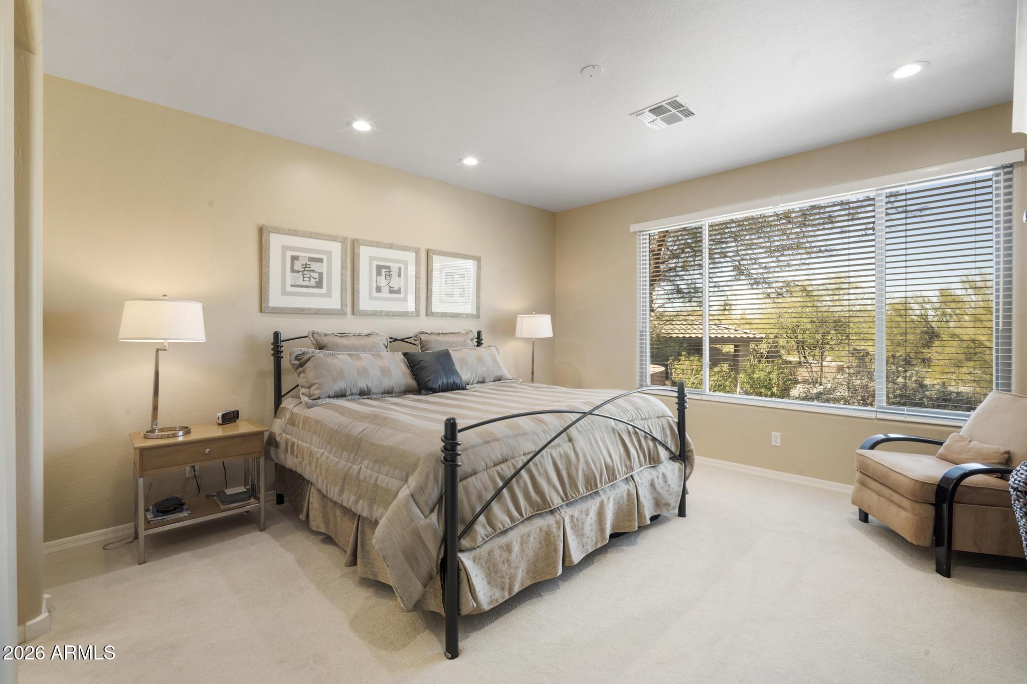11448 East Raintree Drive Scottsdale, AZ 85255 - Photo 20 of 37 a spacious bedroom with a bed and glass window