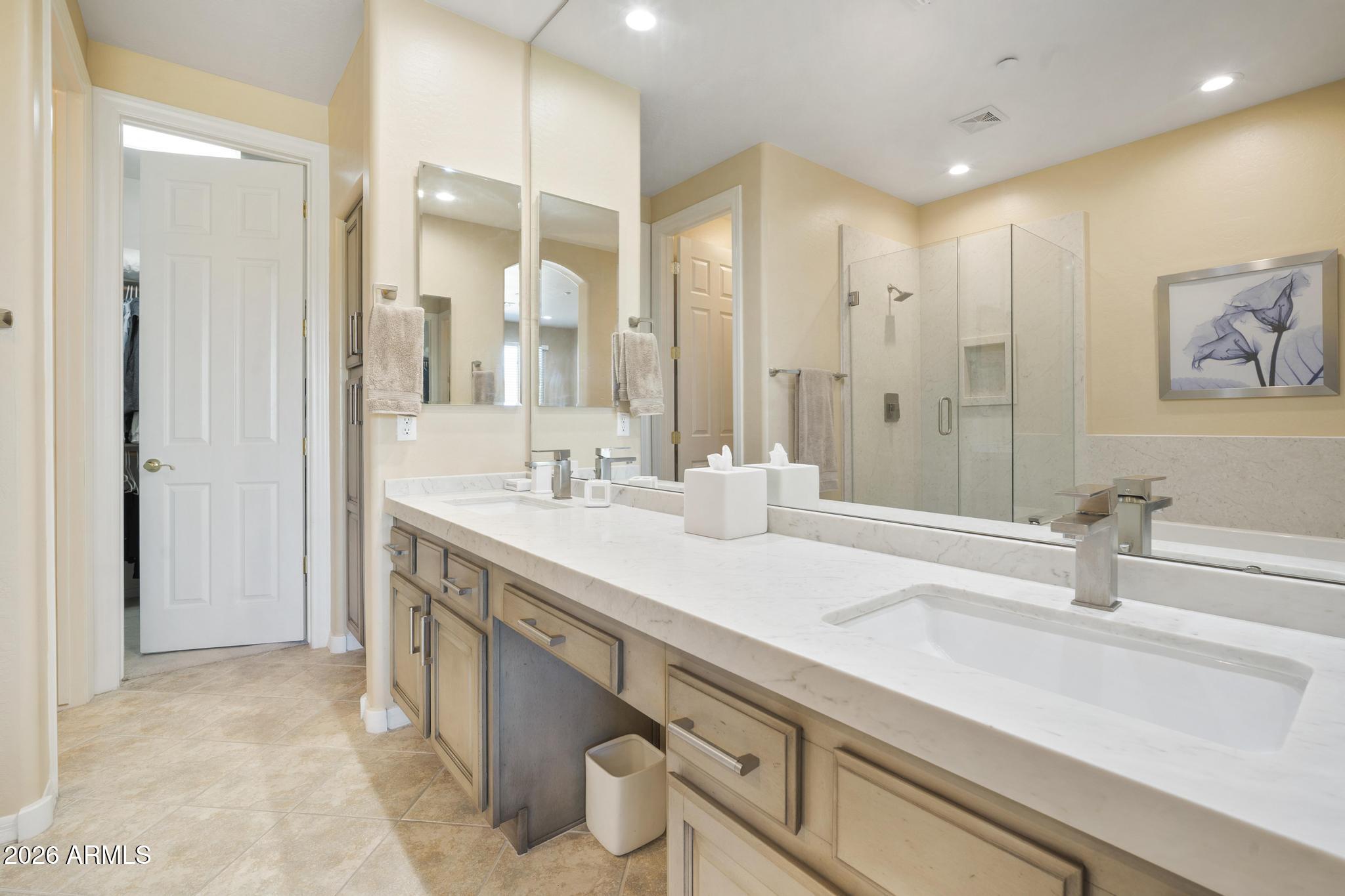 11448 East Raintree Drive Scottsdale, AZ 85255 - Photo 23 of 37 a bathroom with a sink double vanity and a mirror