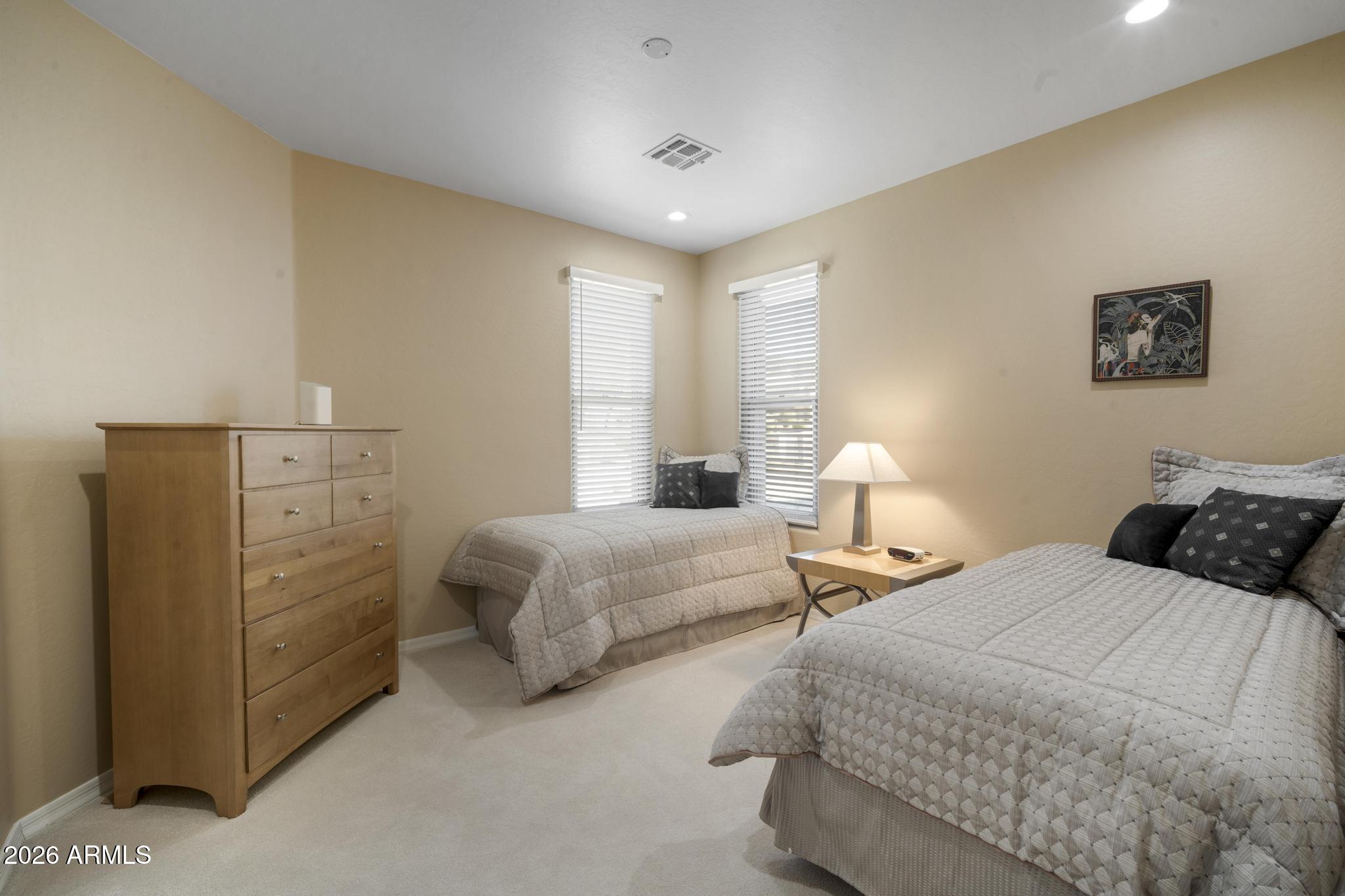 11448 East Raintree Drive Scottsdale, AZ 85255 - Photo 27 of 37 a bedroom with two beds and lamp