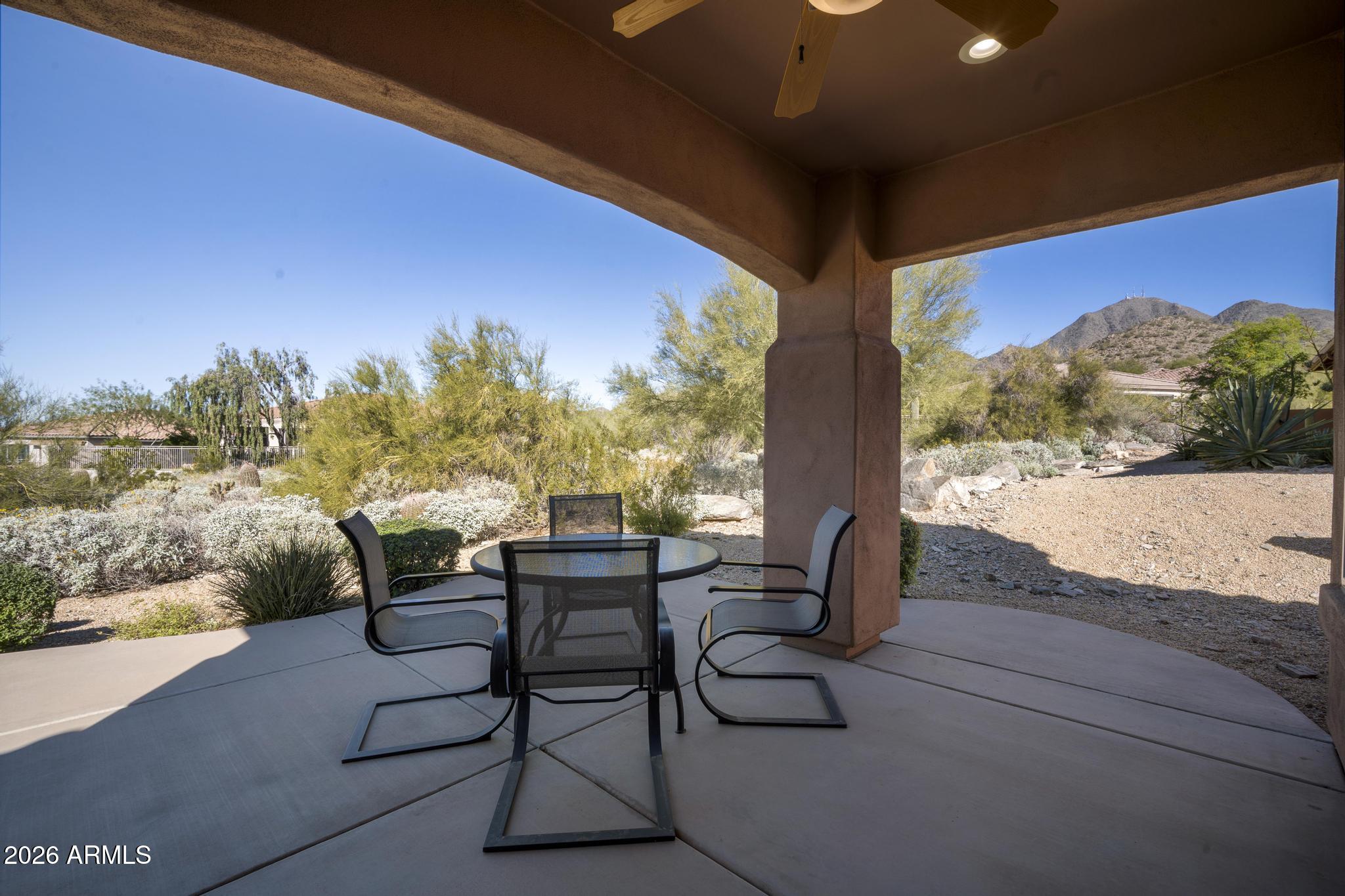 11448 East Raintree Drive Scottsdale, AZ 85255 - Photo 5 of 37 a view of chairs and table in patio