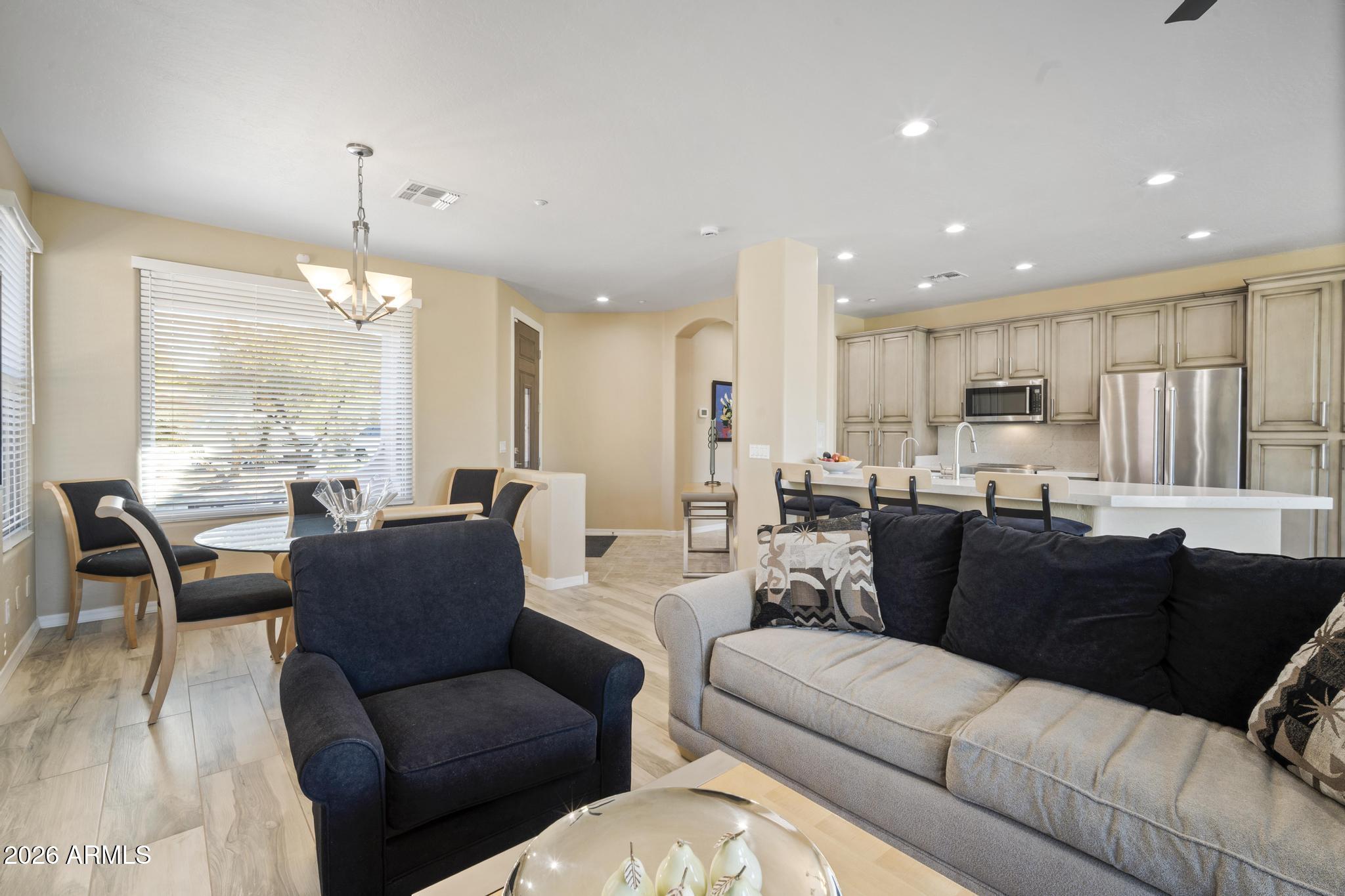 11448 East Raintree Drive Scottsdale, AZ 85255 - Photo 9 of 37 a living room with furniture kitchen view and a large window