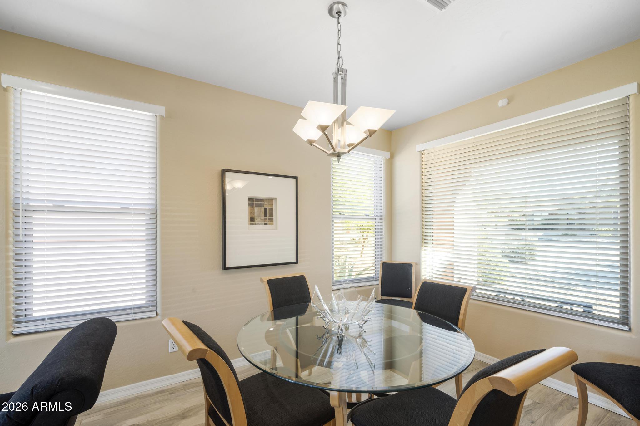 11448 East Raintree Drive Scottsdale, AZ 85255 - Photo 10 of 37 a view of a dining room with furniture window and outside view